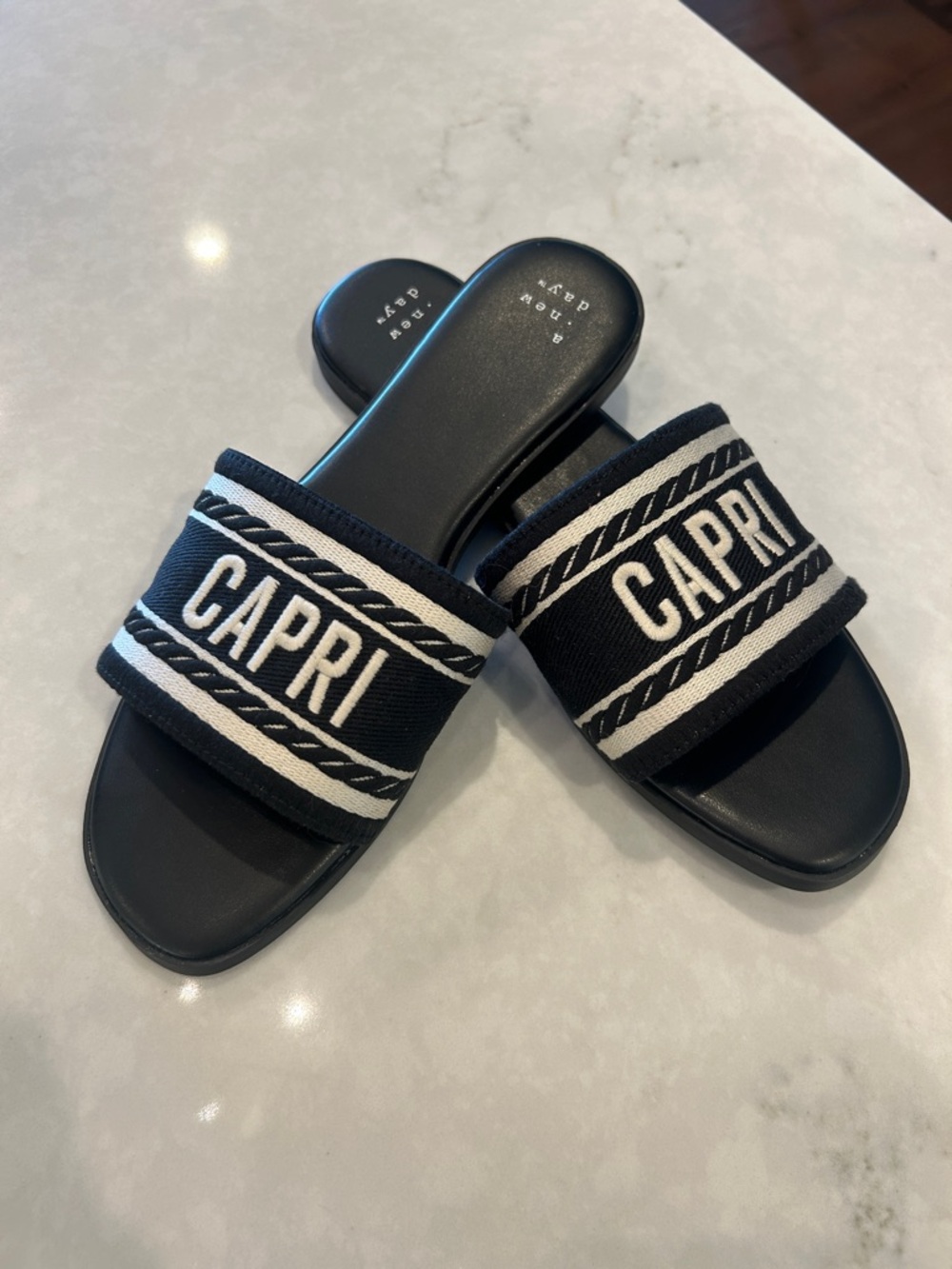 a new day Black Slide Sandals with White Logo Strap